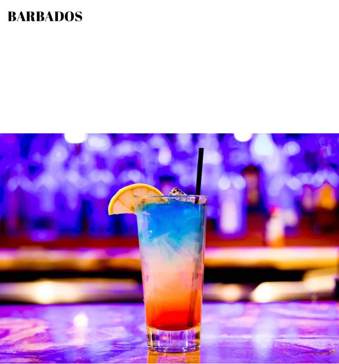 A colorful drink on a bar.