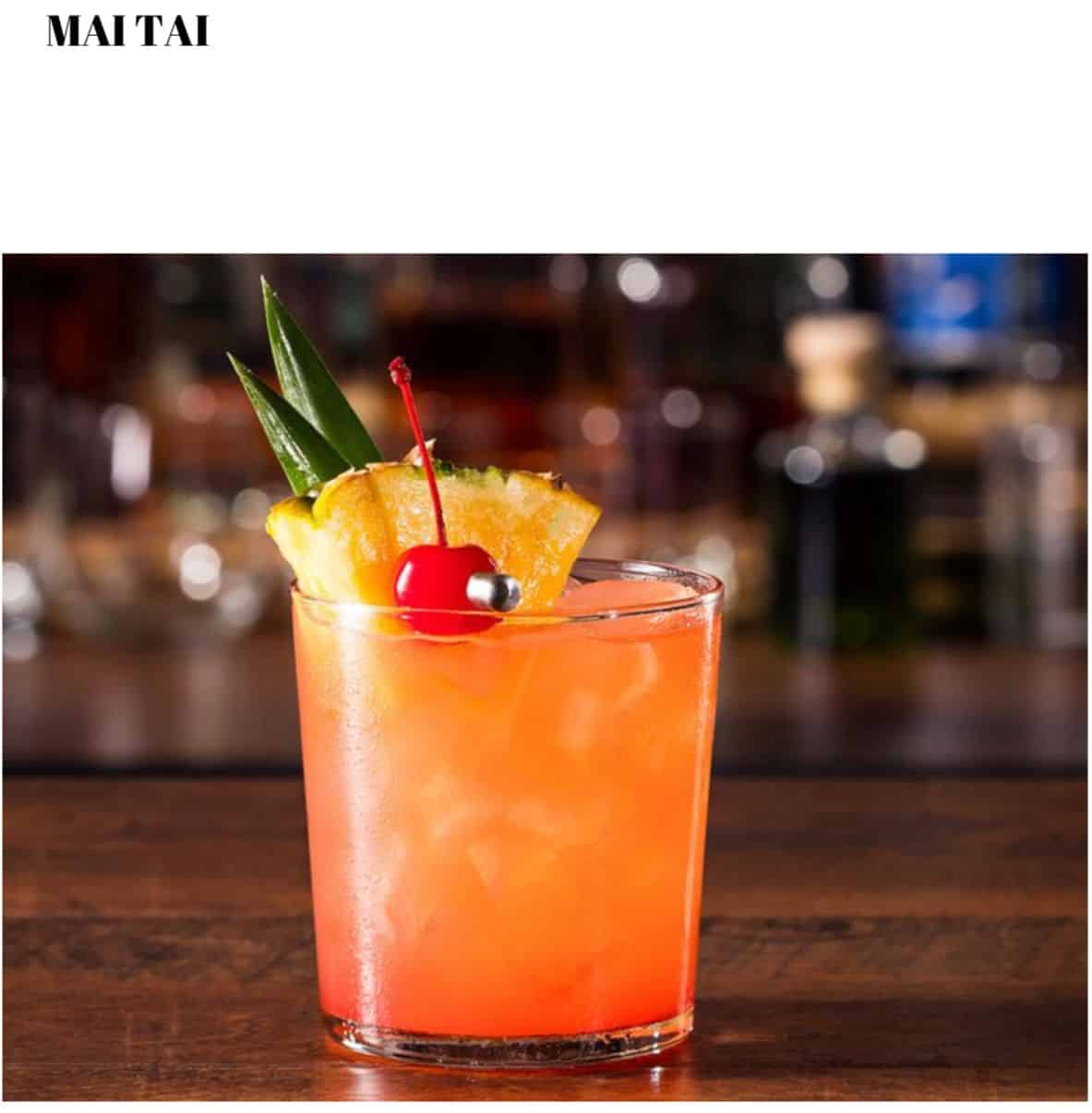 A cocktail with a pineapple garnish on top.