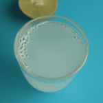 Top view of a Clear cup full of lemon juice